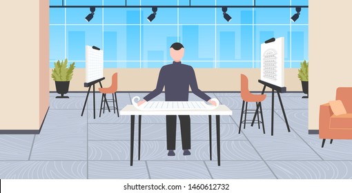 man architect working with blueprint engineer drafting new building model urban panning project concept modern draftsman studio interior full length horizontal