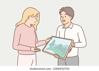 Man artist shows picture to gallery representative wishing to arrange creative exhibition or participate in exposition. Guy with picture of natural landscape demonstrates his own creativity