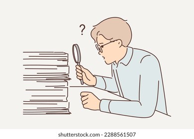 Man auditor looking for errors in financial statements by looking through pile of documents using magnifying glass. Auditor guy is engaged in paperwork and is surprised by number of tax documents 