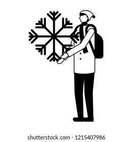 man with backpack holding snowflake winter