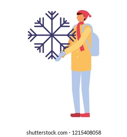 man with backpack holding snowflake winter