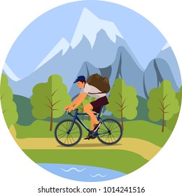 A man with a backpack riding a Bicycle through the woods. Camping trip.