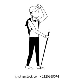 Man with backpack and walking stick in black and white