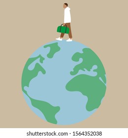 A man with a bag in his hand walks around the globe