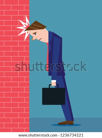 Man banging his head in frustration and regret against brick wall