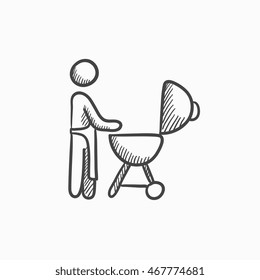 Man at barbecue grill vector sketch icon isolated on background. Hand drawn Man at barbecue grill icon. Man at barbecue grill sketch icon for infographic, website or app.