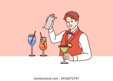 Man bartender prepares cocktail with addition alcohol and syrup with ice, inviting guests to party in nightclub. Bartender guy holds out glass of mojito with slice lime and looks at screen with smile