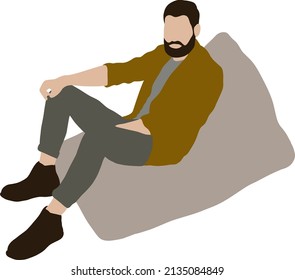 Un hombre con barba se sienta en una bolsa de frijol gris