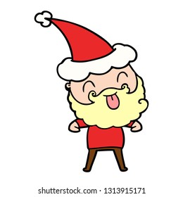 man with beard sticking out tongue wearing santa hat