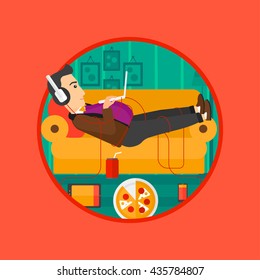 Man with belly relaxing on a sofa with many gadgets. Man lying on a sofa surrounded by gadgets. Man using gadgets at home. Vector flat design illustration in the circle isolated on background.