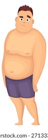 Un hombre con una gran barriga está de pie en la arena