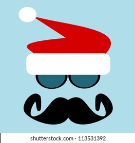 man with big black mustache and sunglasses wearing santa hat