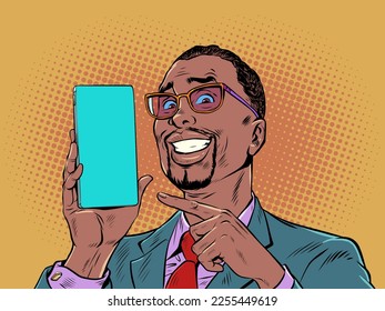 A man with black hair and fashionable glasses smiles and points to the phone. Product demonstration or offer on smartphone. The joy of a perfect purchase. Pop Art Retro Vector Illustration Kitsch