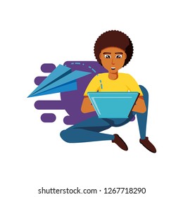man black sitting with laptop computer and airplane paper