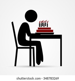 Man blows out the candles on birthday cake