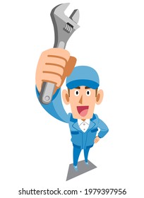 A man in blue work clothes holding a spanner