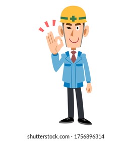 A man in a blue workwear wearing a helmet giving an OK sign