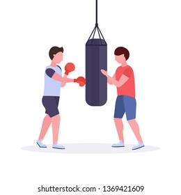 man boxer with personal trainer hitting punching bag in red boxing gloves guy fighter training workout fight club healthy lifestyle concept flat white background