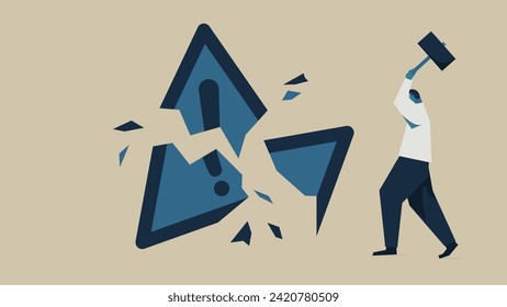 A man breaking a danger mark with a hammer.