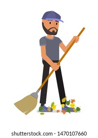 A man with a broom sweeps away fallen leaves. Isolated on a white background.