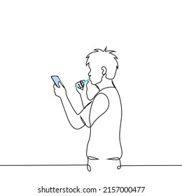 man brushing his teeth while looking at the phone - one line drawing vector. concept internet or phone addiction, breaking news, urgent business, being late