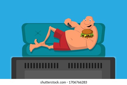 Man with burger on the couch watching TV