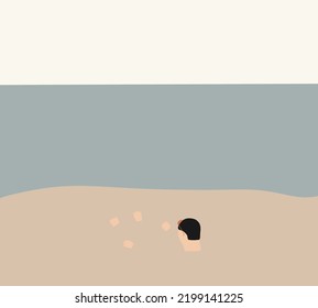 Man buried in sand on the beach. Taking sunbath with body under ground near ocean. Travel summer vacation lifestyle.