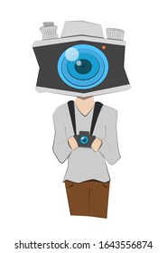 A man with camera head holding black camera in his hand.