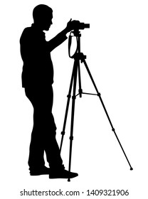 Man with a camera on white background