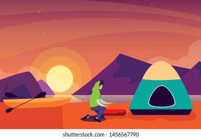 man with camping tent on the river shore