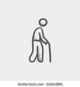 Man with cane sketch icon for web, mobile and infographics. Hand drawn vector dark grey icon isolated on light grey background.