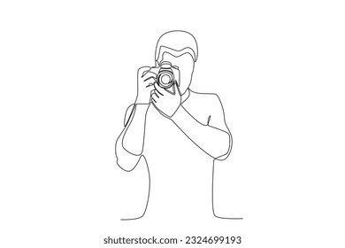 A man captures the image with a camera. World photography day one-line drawing