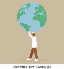 A man carries a large globe