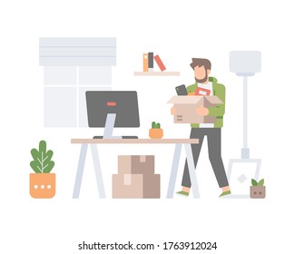 A man is carrying a box of goods and tidying his new office at home