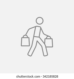 Man carrying shopping bags line icon for web, mobile and infographics. Vector dark grey icon isolated on light grey background.