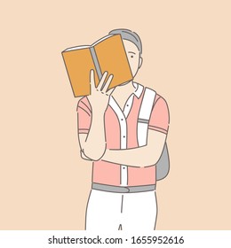 Man in casual clothes reading yellow paper book vector cartoon illustration isolated on pink background. Intelligent man, Intellectual hobby, student preparing for exams, researching outline concept.