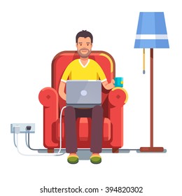 Man in casual outfit sitting home in comfortable armchair and browsing or working on laptop at his laps. Flat style color modern vector illustration.