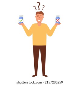 Man choosing between two options.Man thinking about vaccine.The guy chooses the medicine.Difficult choice in pharmacy.The guy is holding two jars of pills.