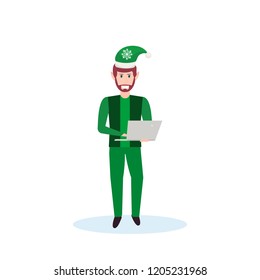 man christmas elf santa helper concept using laptop flat full length male cartoon character isolated vector illustration