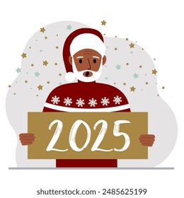 Un hombre con un sombrero rojo de Navidad con copos de nieve sostiene una tarjeta de Feliz Año Nuevo 2025.