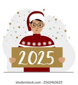 A man in a Christmas red hat with snowflakes holds a Happy New Year 2025 card.