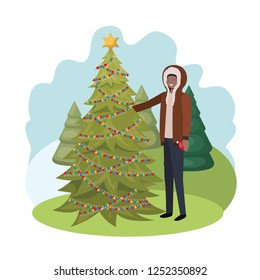 man with christmas tree in landscape