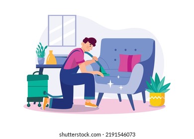 Man cleaning the sofa with the vacuum cleaner