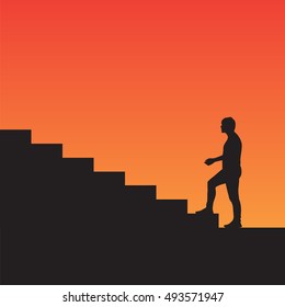 Man climbs the stairs silhouette, on the sunset background