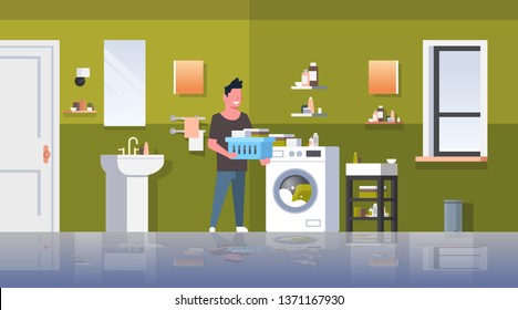 man with clothes basket standing near washing machine guy doing housework laundry room modern bathroom interior male cartoon character full length flat horizontal