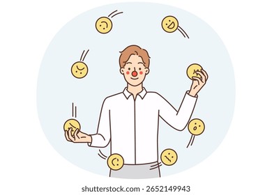 Homem com rosto de palhaço faz malabarismos emoticons com emoções diferentes simbolizando tentativa de esconder suas próprias emoções. O cara lança sorrisos para animar e fazer o público ou os convidados rirem na performance teatral