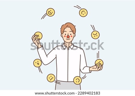 Man with clown face juggles emoticons with different emotions symbolizing attempt to hide own emotions. Guy throws smileys to cheer and make audience or guests laugh in theatrical performance