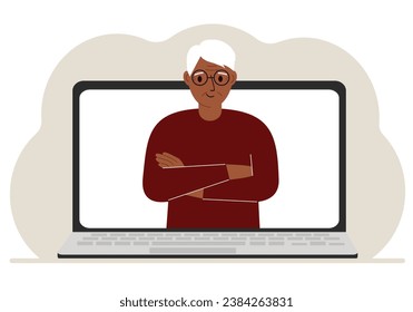 Man communicates via videoconference through laptop screen. The concept of online meetings, webinars, remote work or work from home.