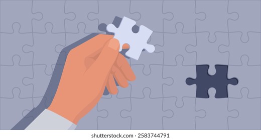 Man completing a jigsaw puzzle, he is holding the correct piece