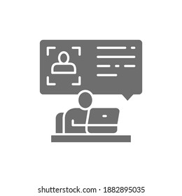 Man at computer reads a resume, id verification grey icon.